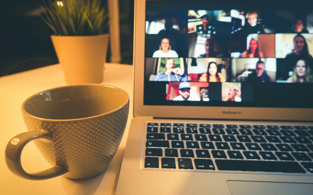 macbook air displaying woman in white shirt